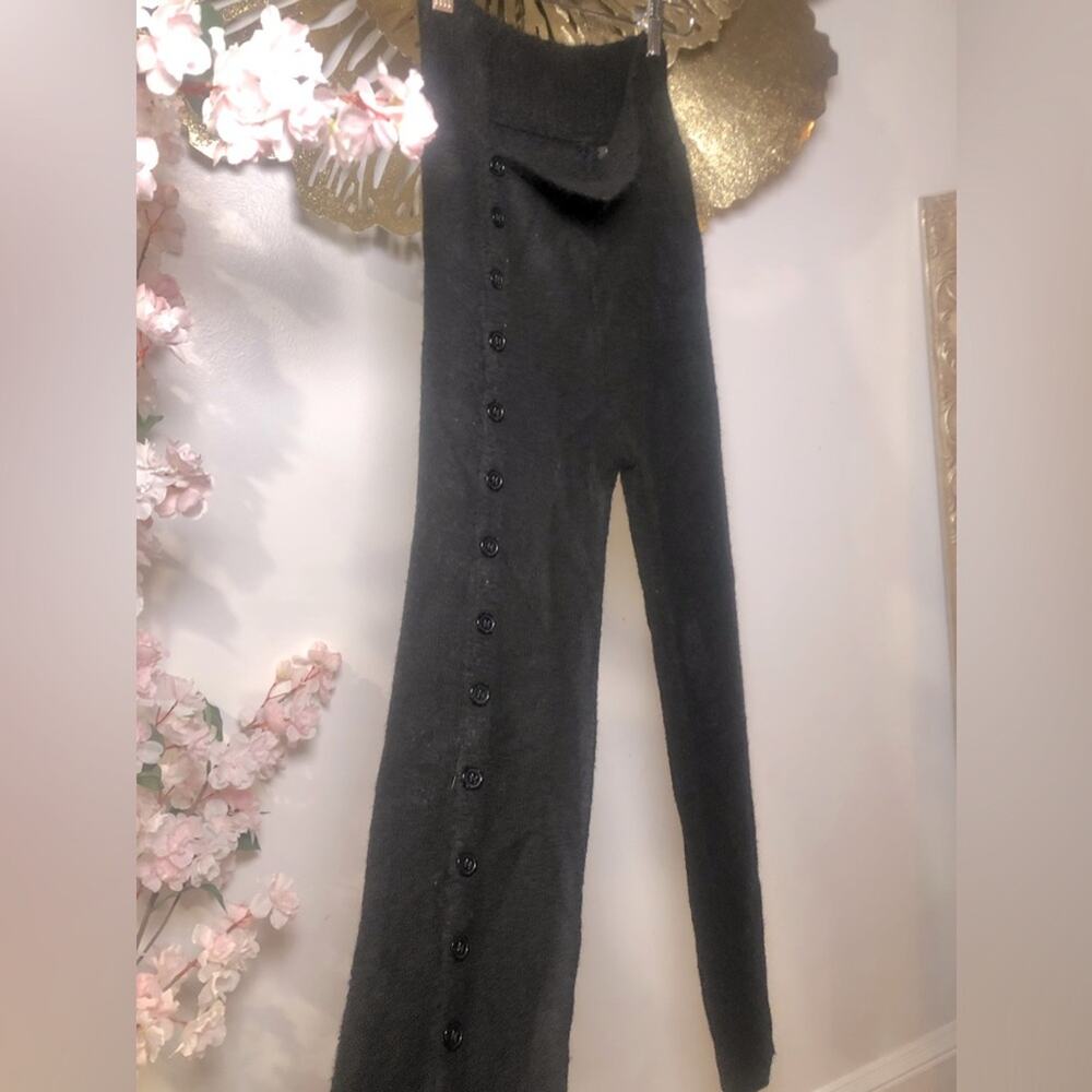 Designer wool pants right buttoned side. Left buttoned front.